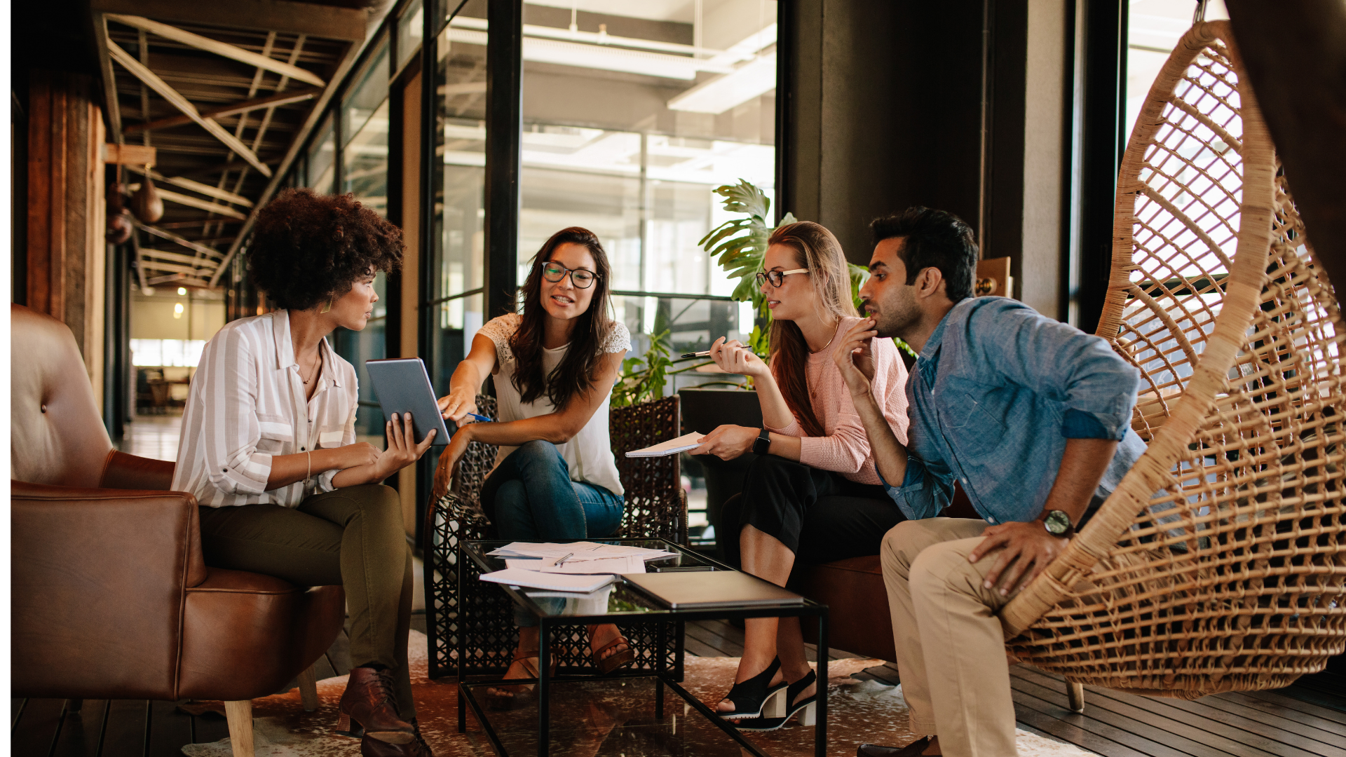 Diverse team collaborating in modern office for Harlee Reed Voice
