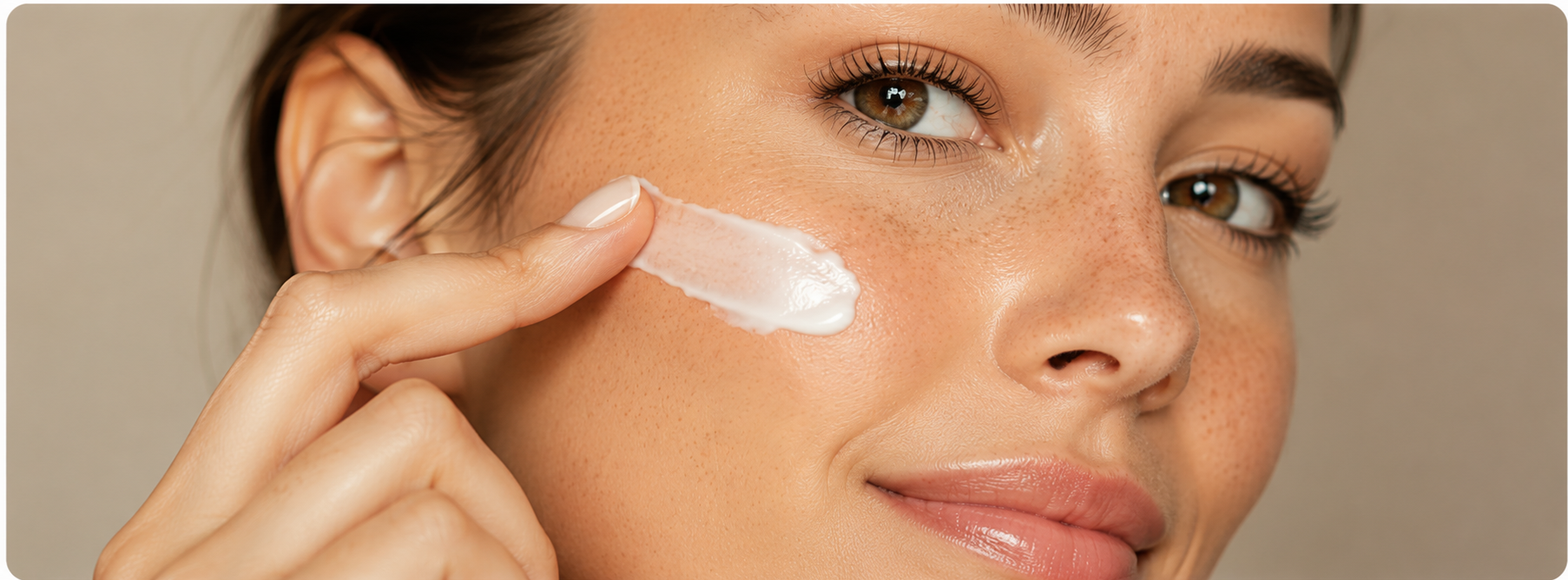 Woman applying moisturizing skincare cream to cheek for Harlee Reed Voice